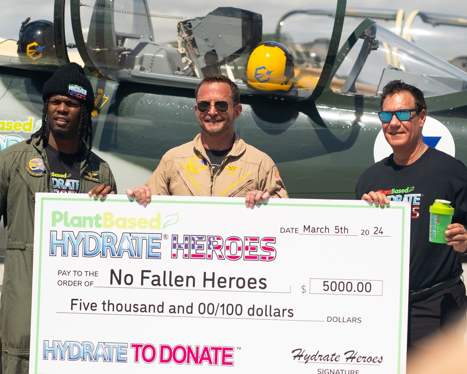 Michael Gardner presenting a $5,000 donation check to the No Fallen Heroes Foundation
